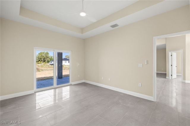 1043 Albert Ave, Lehigh Acres, FL 33971 - empty room with a ceiling fan, baseboards, visible vents, and tile patterned flooring