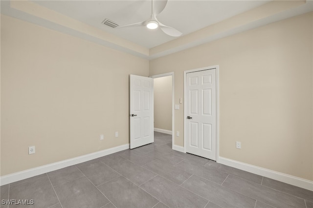1043 Albert Ave, Lehigh Acres, FL 33971 - spare room with a ceiling fan, tile patterned floors, visible vents, and baseboards