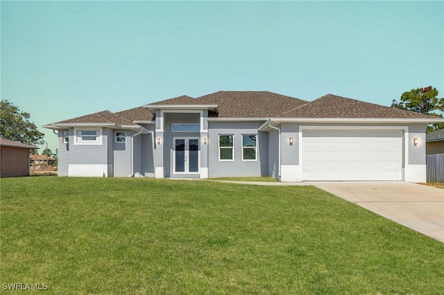 1043 Albert Ave, Lehigh Acres, FL 33971 - prairie-style home featuring a garage, a front lawn, stucco siding, and concrete driveway