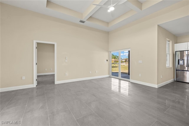 1043 Albert Ave, Lehigh Acres, FL 33971 - tiled empty room featuring a ceiling fan, a towering ceiling, beamed ceiling, visible vents, and coffered ceiling
