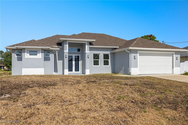 1043 Albert Ave, Lehigh Acres, FL 33971 - prairie-style house with a garage, a front yard, stucco siding, french doors, and driveway