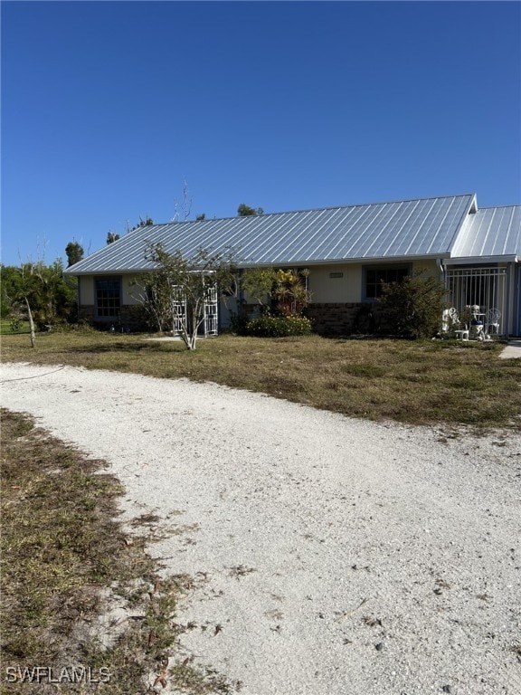exterior space with metal roof