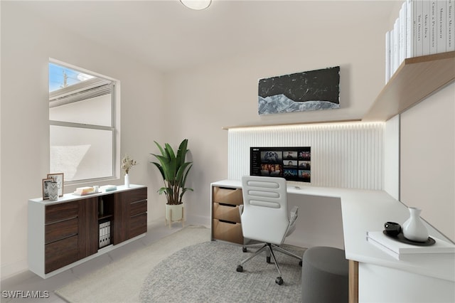carpeted office with baseboards