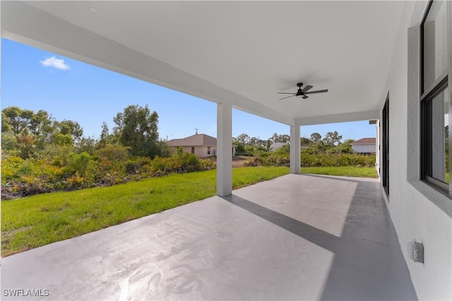view of patio featuring ceiling fan