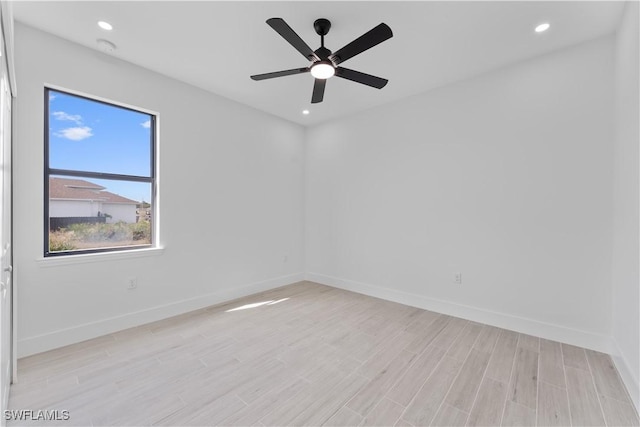 empty room featuring recessed lighting, baseboards, ceiling fan, and light wood finished floors
