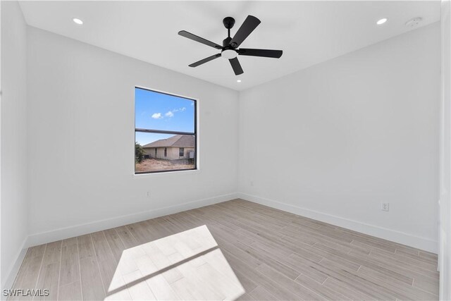 unfurnished room featuring recessed lighting, baseboards, ceiling fan, and light wood-type flooring