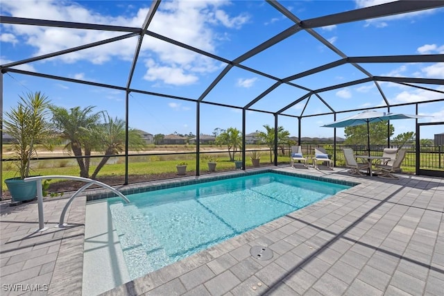 outdoor pool with a patio and a lanai