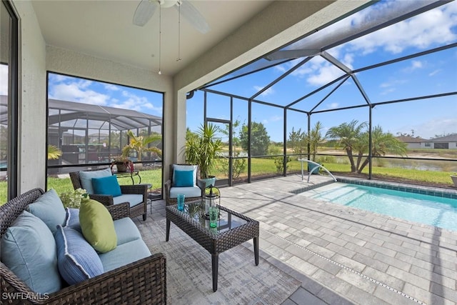 outdoor pool with outdoor lounge area, a lanai, and a patio area