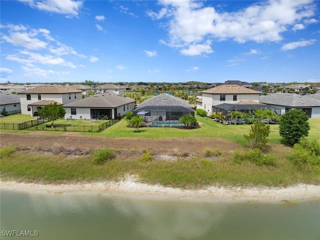 birds eye view of property featuring a water view and a residential view