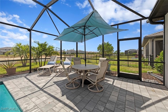 sunroom / solarium featuring outdoor dining space