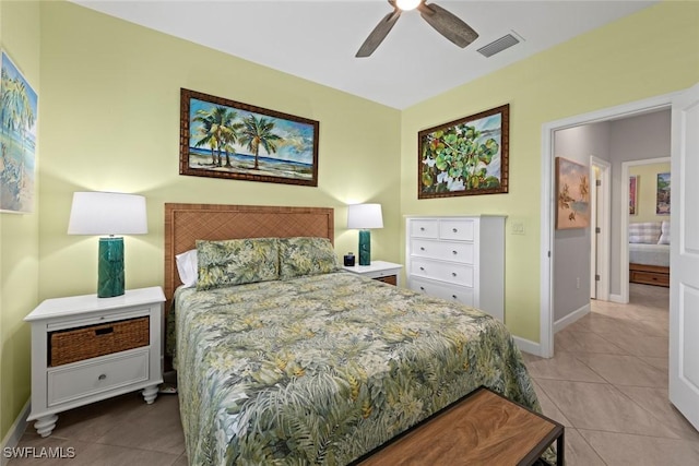 bedroom with visible vents, baseboards, and light tile patterned flooring