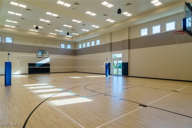 view of sport court featuring community basketball court and a healthy amount of sunlight