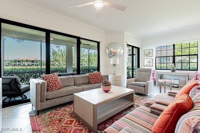 2173 Frangipani Cir Unit 102, Naples, FL 34120 - living room featuring crown molding, healthy amount of natural light, ceiling fan, and tile patterned flooring