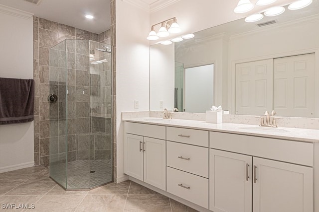 2173 Frangipani Cir Unit 102, Naples, FL 34120 - bathroom featuring crown molding, a shower stall, double vanity, and baseboards