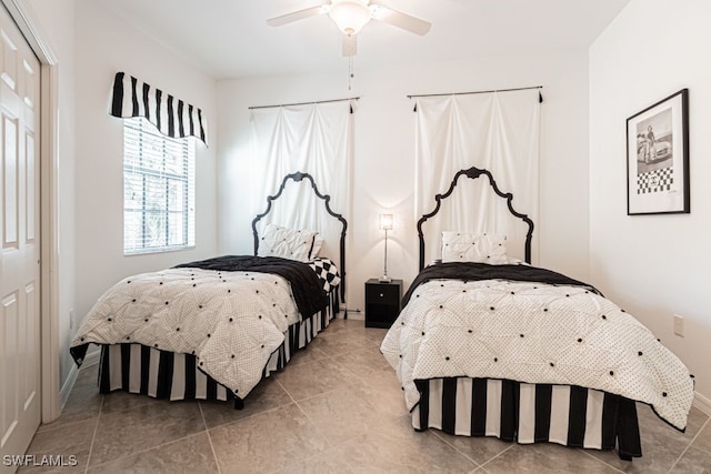2173 Frangipani Cir Unit 102, Naples, FL 34120 - bedroom with tile patterned floors, baseboards, and a ceiling fan