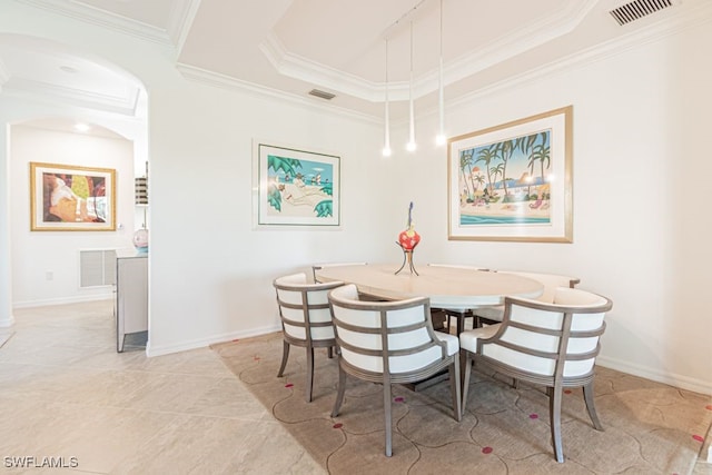 2173 Frangipani Cir Unit 102, Naples, FL 34120 - dining space featuring arched walkways, crown molding, baseboards, light tile patterned floors, and a tray ceiling