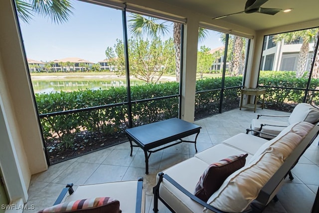 2173 Frangipani Cir Unit 102, Naples, FL 34120 - sunroom / solarium with a water view, ceiling fan, tile patterned flooring, and an outdoor hangout area