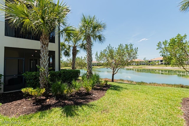 2173 Frangipani Cir Unit 102, Naples, FL 34120 - view of green lawn with a water view