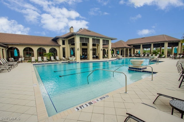 2173 Frangipani Cir Unit 102, Naples, FL 34120 - community pool featuring a patio area