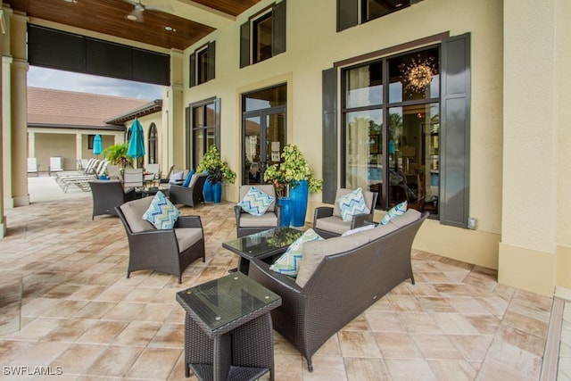 2173 Frangipani Cir Unit 102, Naples, FL 34120 - view of patio featuring an outdoor living space and a ceiling fan