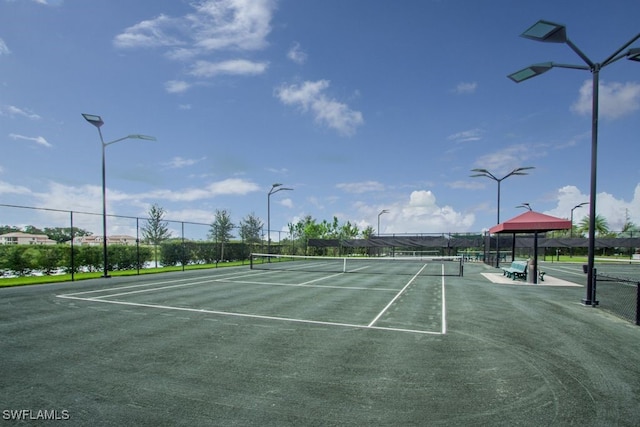 2173 Frangipani Cir Unit 102, Naples, FL 34120 - view of tennis court with fence