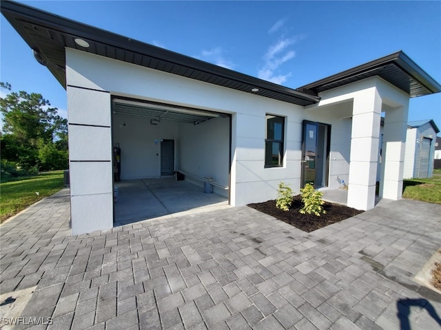 3117 35th St SW, Lehigh Acres, FL 33976 - view of front of house featuring a garage and driveway