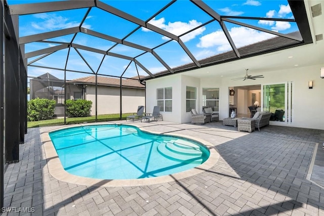 28616 Wharton Dr, Bonita Springs, FL 34135 - swimming pool featuring a patio area, a ceiling fan, an outdoor living space, and glass enclosure
