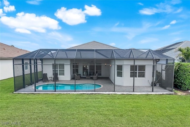 28616 Wharton Dr, Bonita Springs, FL 34135 - back of property featuring stucco siding, a patio area, a lawn, an outdoor pool, and glass enclosure