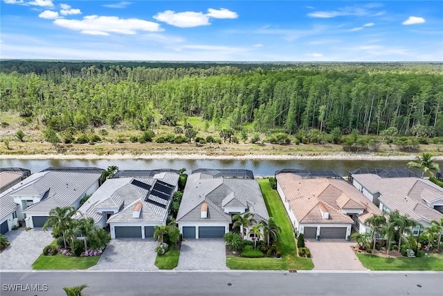 28616 Wharton Dr, Bonita Springs, FL 34135 - aerial perspective of suburban area with a heavily wooded area and a nearby body of water