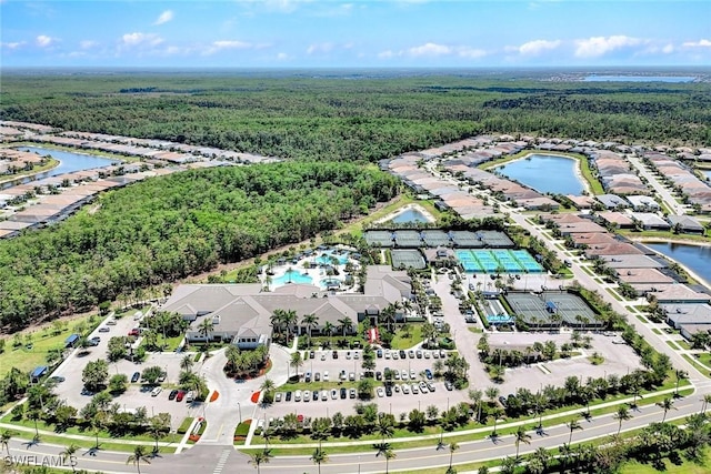28616 Wharton Dr, Bonita Springs, FL 34135 - bird's eye view of a forest, a nearby body of water, and a pool area