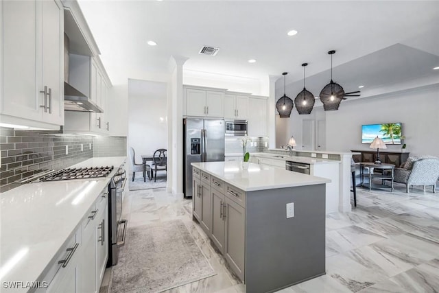 28616 Wharton Dr, Bonita Springs, FL 34135 - kitchen with appliances with stainless steel finishes, a sink, a peninsula, backsplash, and recessed lighting