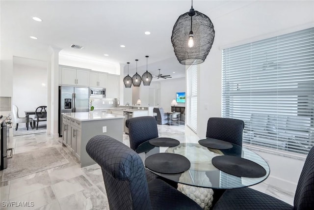 28616 Wharton Dr, Bonita Springs, FL 34135 - dining room with light marble finish floors and recessed lighting