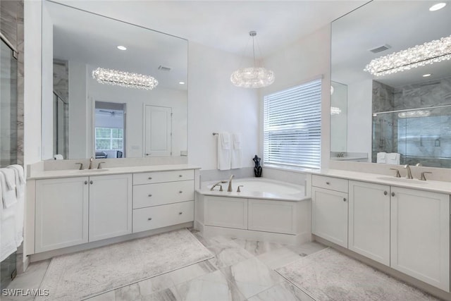 28616 Wharton Dr, Bonita Springs, FL 34135 - full bathroom with a chandelier, a shower stall, two vanities, marble finish floors, and recessed lighting