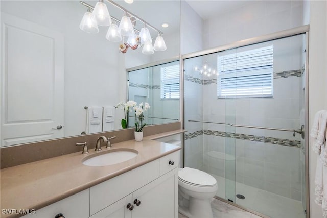 28616 Wharton Dr, Bonita Springs, FL 34135 - bathroom with a shower stall, vanity, and toilet