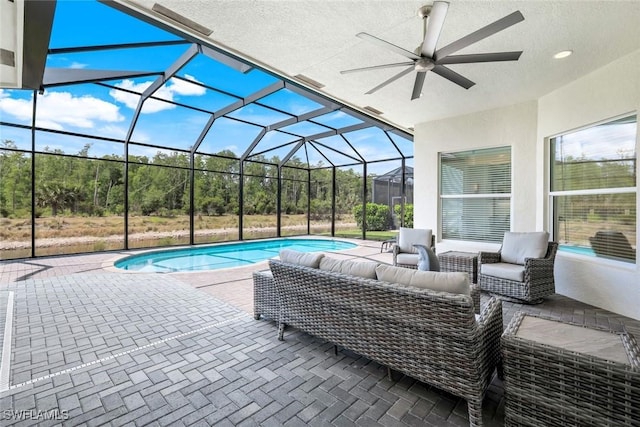 28616 Wharton Dr, Bonita Springs, FL 34135 - outdoor pool featuring an outdoor living space, a patio, ceiling fan, and glass enclosure