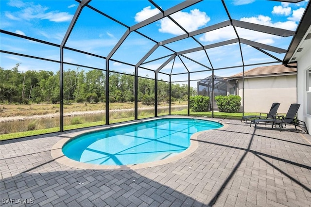 28616 Wharton Dr, Bonita Springs, FL 34135 - swimming pool featuring a patio and glass enclosure