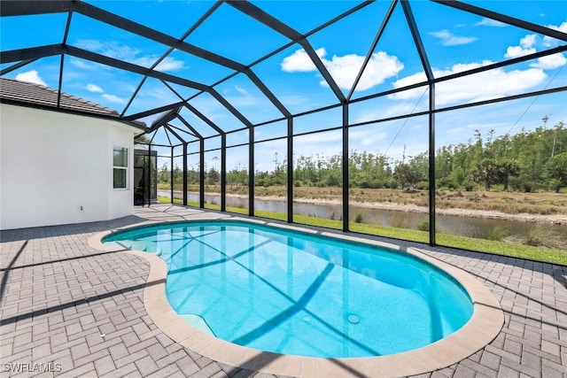28616 Wharton Dr, Bonita Springs, FL 34135 - outdoor pool with a patio, a water view, and glass enclosure