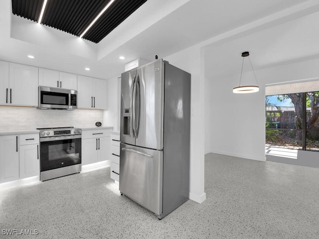 kitchen with decorative backsplash, baseboards, recessed lighting, white cabinetry, and appliances with stainless steel finishes
