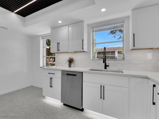kitchen with a sink, tasteful backsplash, recessed lighting, and dishwasher