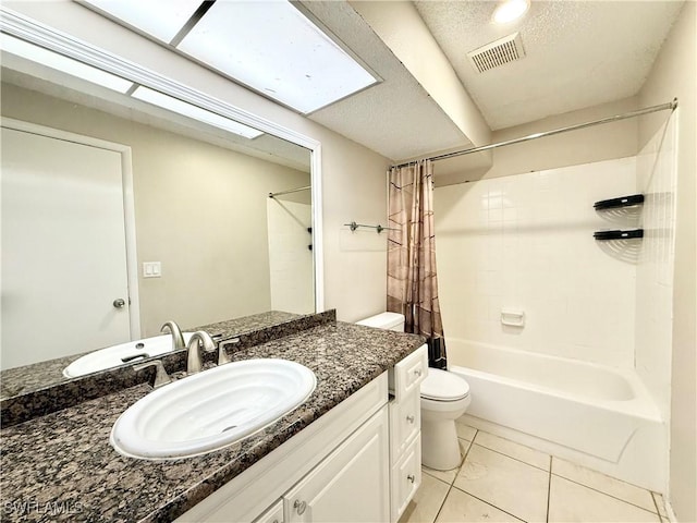 bathroom featuring shower / bath combination with curtain, visible vents, tile patterned flooring, vanity, and toilet