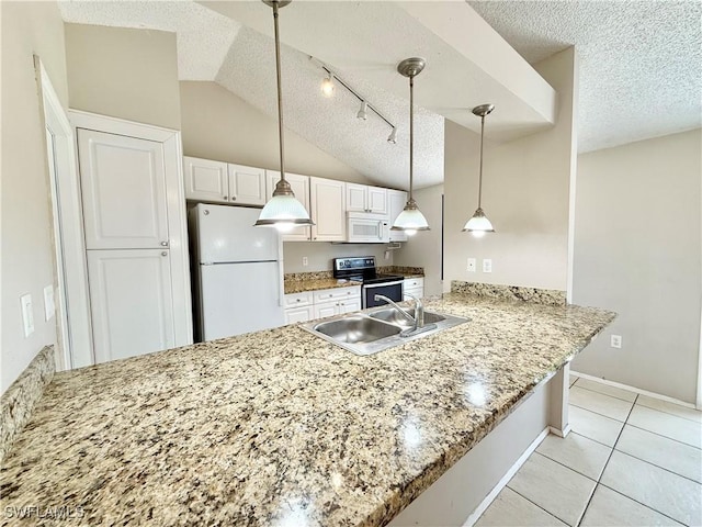 kitchen featuring white appliances, a peninsula, a textured ceiling, and a sink
