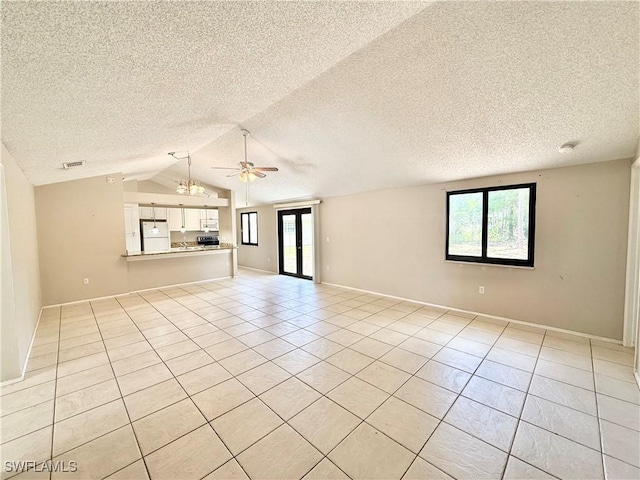 unfurnished living room featuring a ceiling fan, a textured ceiling, and light tile patterned floors