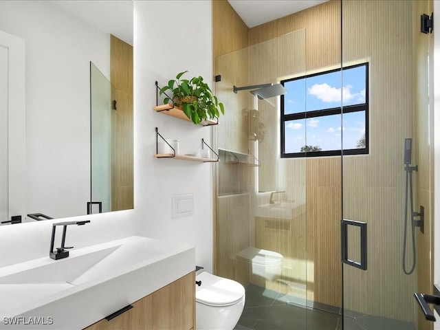 full bath featuring vanity, toilet, tile patterned flooring, and a stall shower