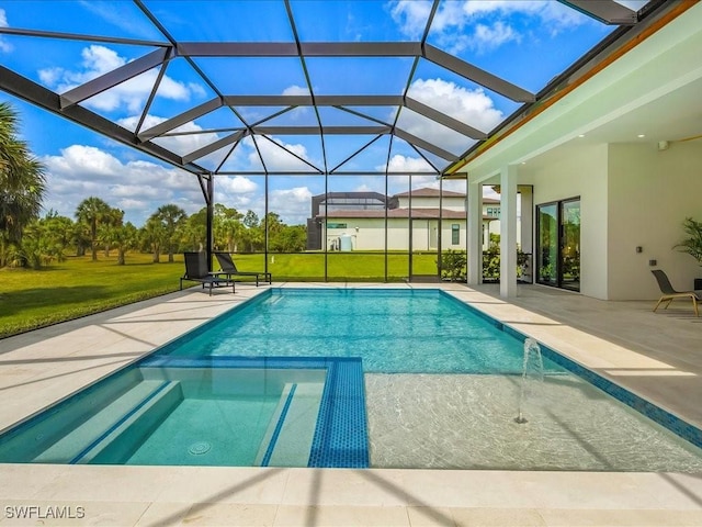 view of pool featuring a lawn, a patio, and a pool with connected hot tub