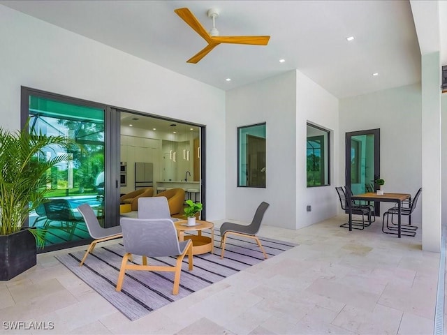 view of patio / terrace with a ceiling fan and outdoor dining area