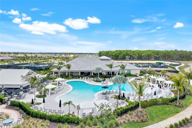community pool with a patio area