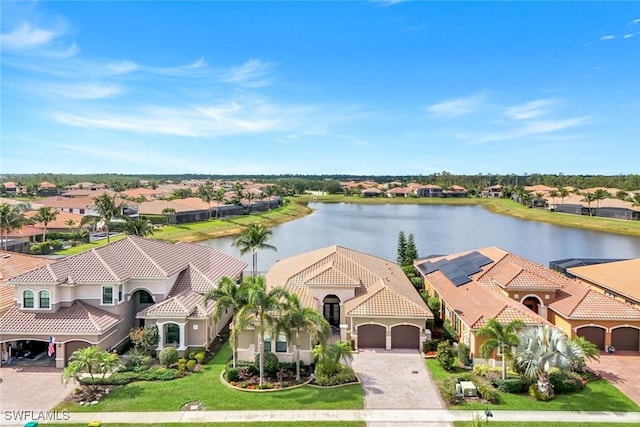 aerial perspective of suburban area featuring a nearby body of water