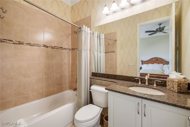 bathroom featuring shower / tub combo, vanity, toilet, and a ceiling fan