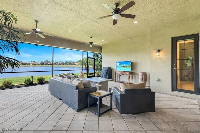 view of patio featuring a ceiling fan and an outdoor living space