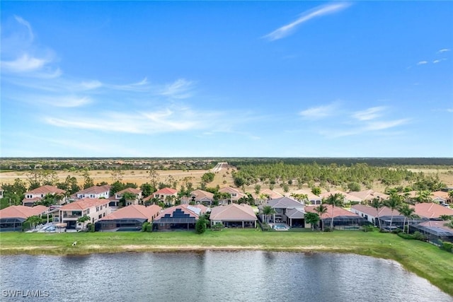 aerial view of residential area with a large body of water